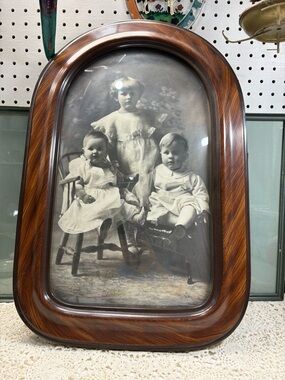 antique portrait featuring convex bubble glass